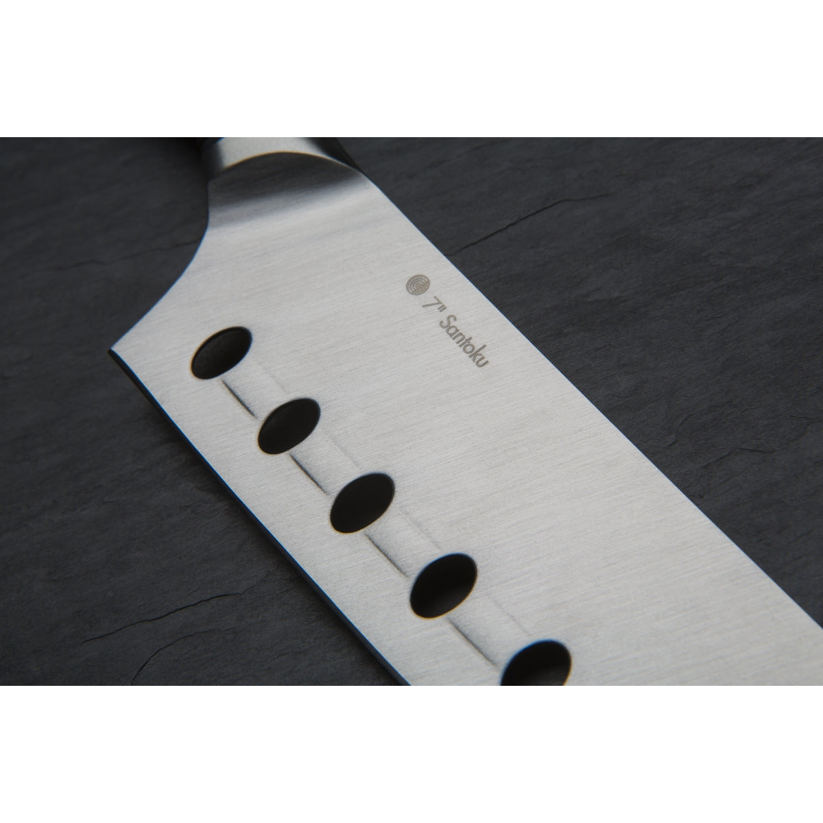 Close up of unique hole-and-ridge technology on the blade of the Circulon Santoku Knife