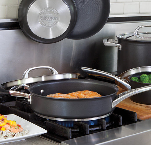 Frying pan on modern black induction stove, cooker, hob or built