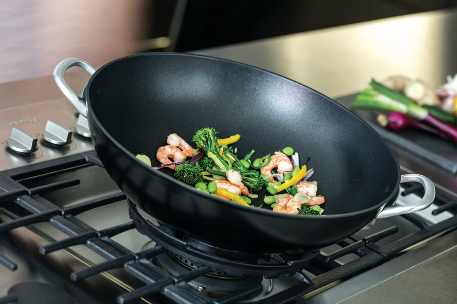 Circulon Round Stainless Silver Wok on Stove