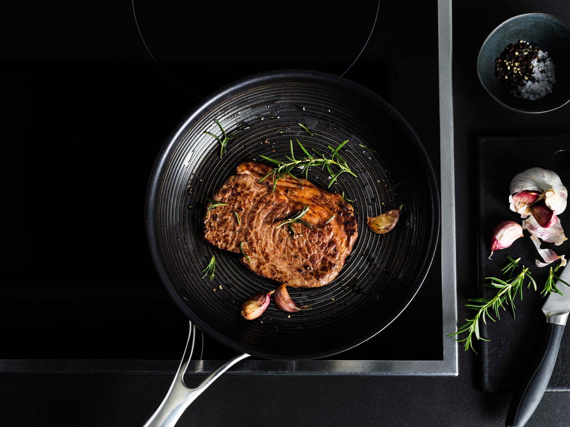 Steak being cooked in a Circulon frying pan