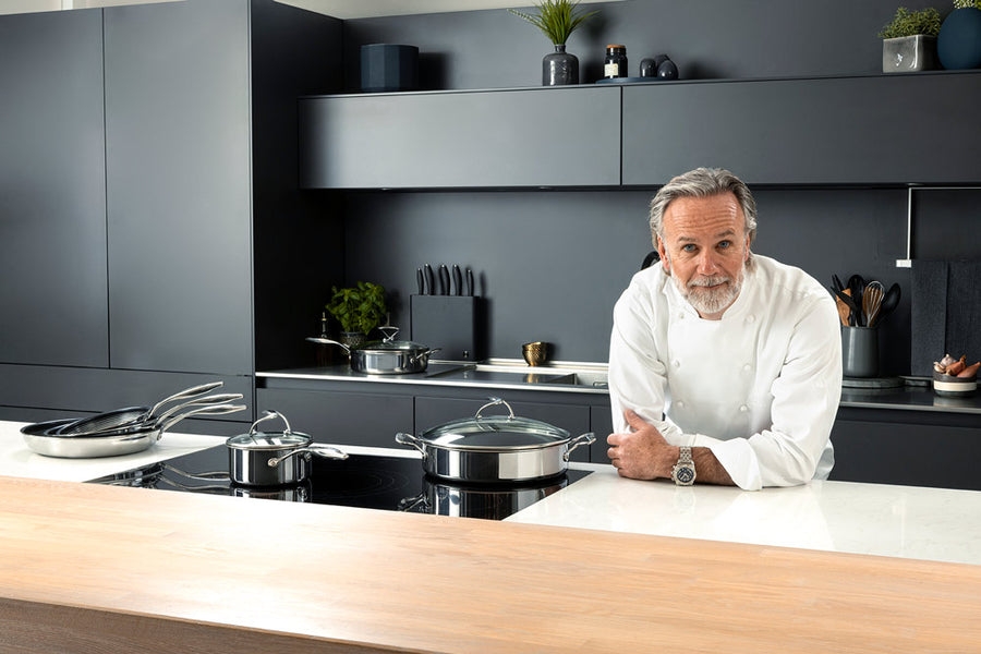 Chef Marcus Wareing in a kitchen with SteelShield pans