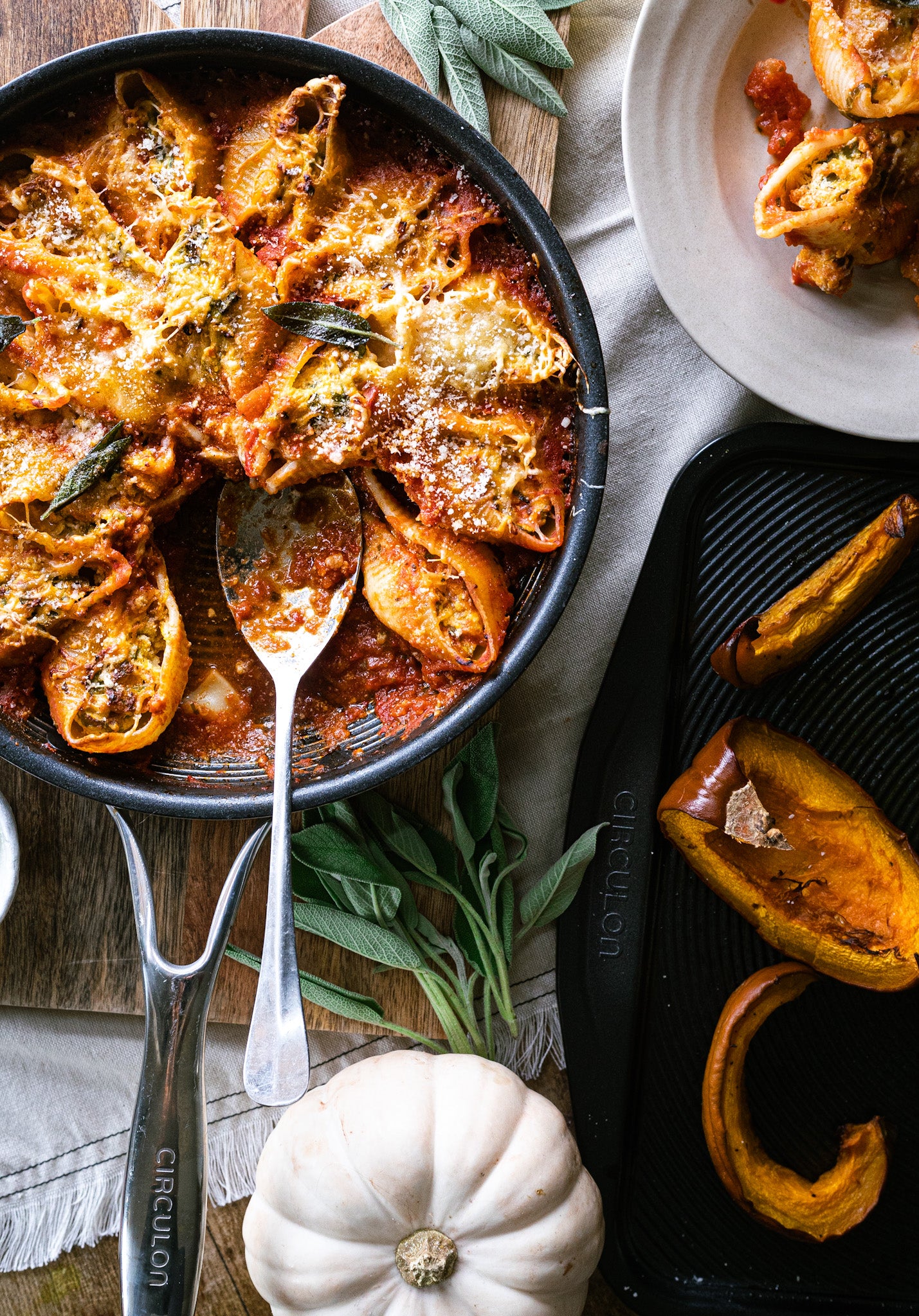 Pumpkin, spinach & ricotta stuffed pasta shells in a skillet