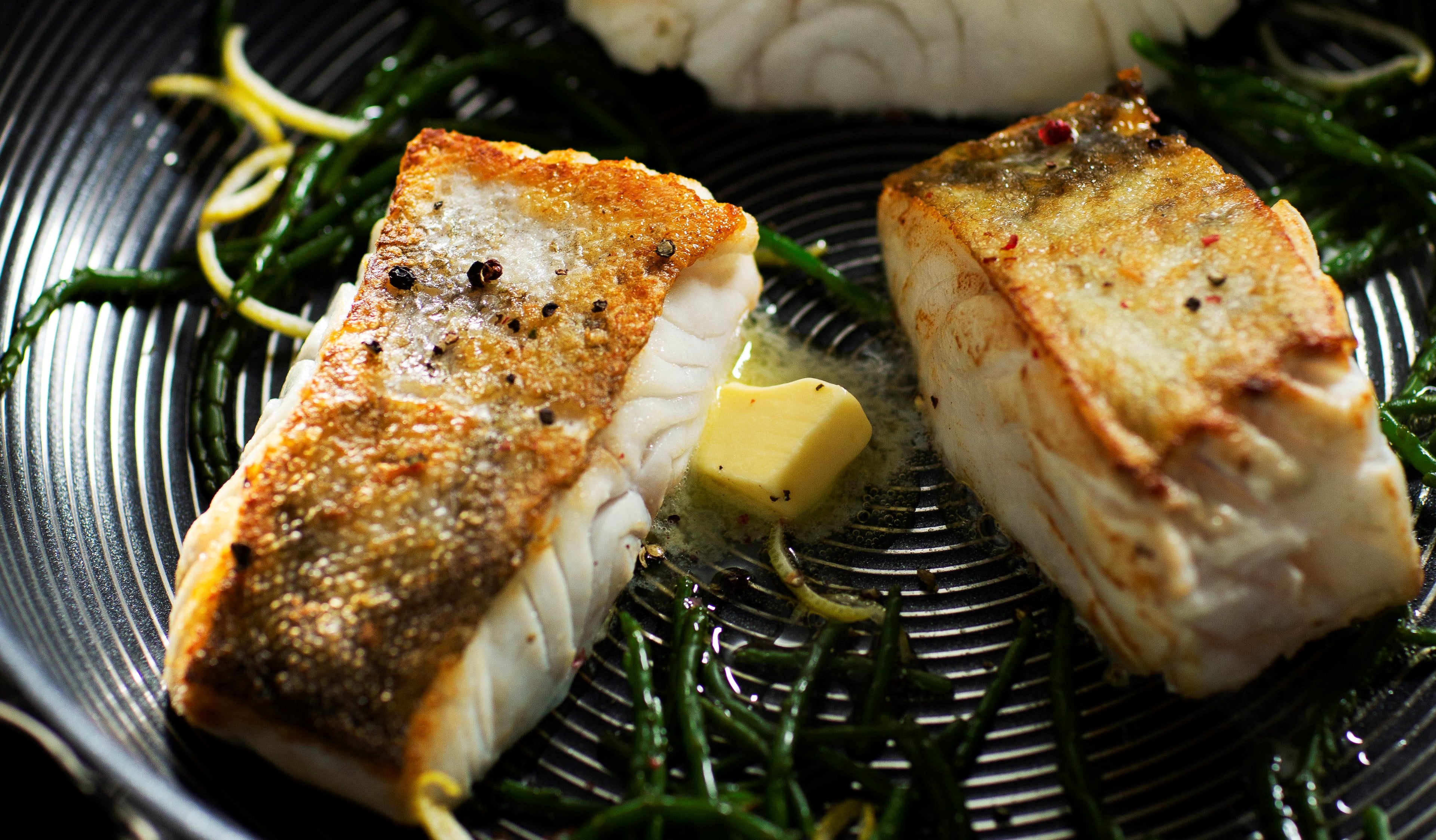 Cod fillets fried in a SteelShield frying pan with samphire