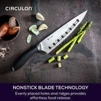 Image shows the 8" Chef's knife on a dark background with sliced asparagus and garlic. Text reads: Nonstick blade technology with evenly placed holes and ridges provides effortless food release.