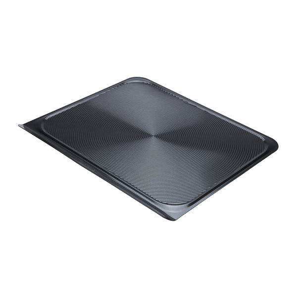 Flat non-stick baking sheet on a white background