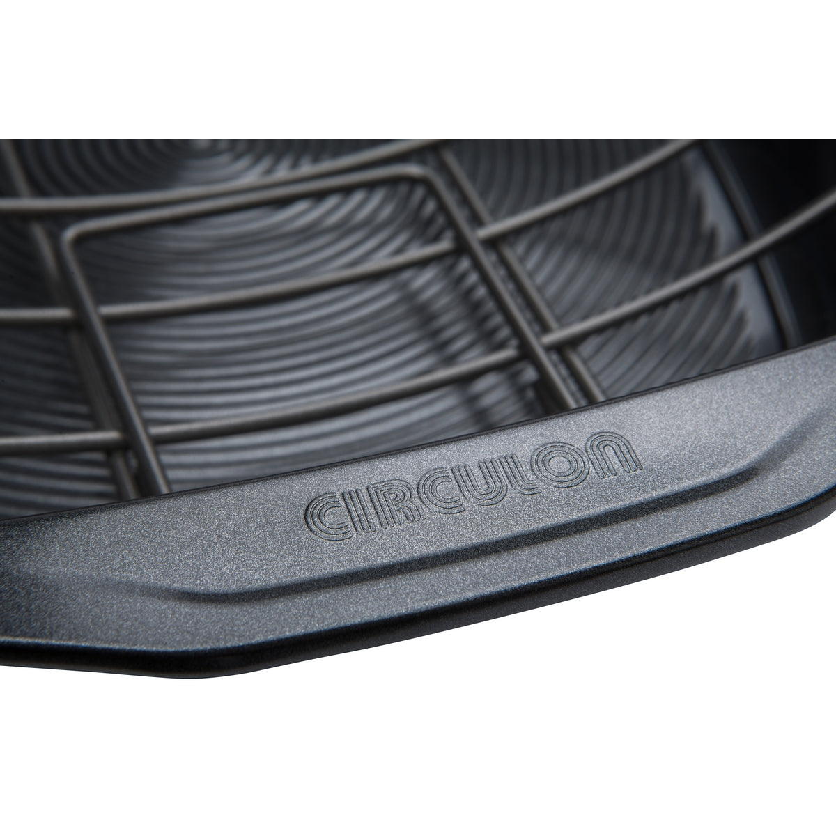 Close up of Circulon logo on the edge of the non-stick roasting tin. Shows handles on tray can fold down.