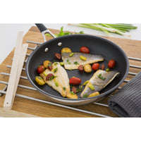 Momentum stainless steel frying pan. Raised circle & non stick interior delivers incredible food release so no food gets stuck in the pan
