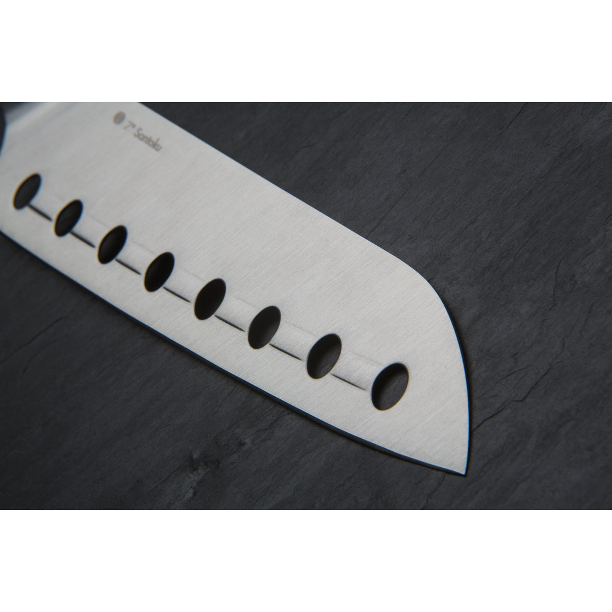 Close up of unique hole-and-ridge technology on the blade of the Circulon Santoku Knife