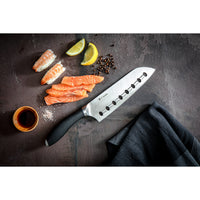 Japanese style Santoku Knife with sliced sashimi and sushi.