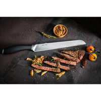 Image shows the 8" Slicer Knife with finely sliced steak to demonstrate the precision cutting.